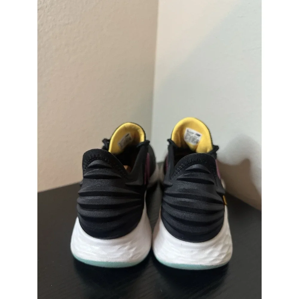 New Balance Black Athletic Sneakers with Pink and Yellow Accents